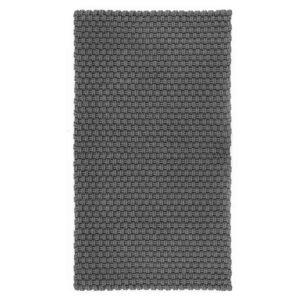 Der strukturierte pad Teppich in dunklem Grau schafft eine warme Grundlage für Cocooning und entspannte Wohnzonen.